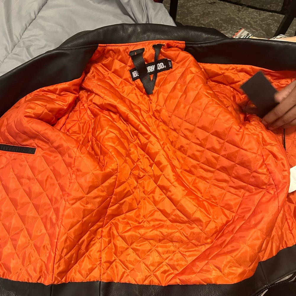 Orange on the inside and a skeleton design on the outside vlone jacket size L